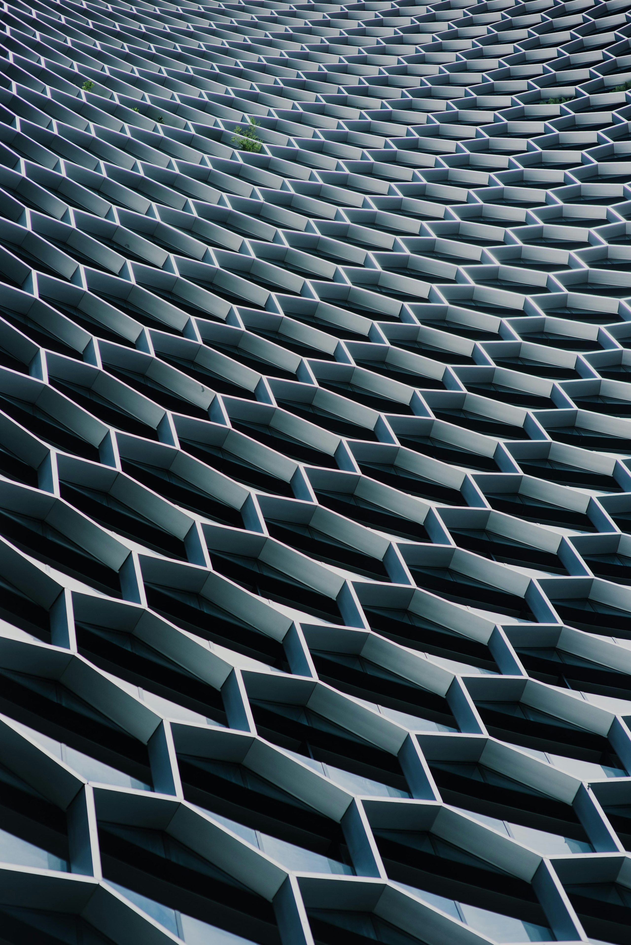 A low-angle view turns a high-rise facade into a rippling grid.