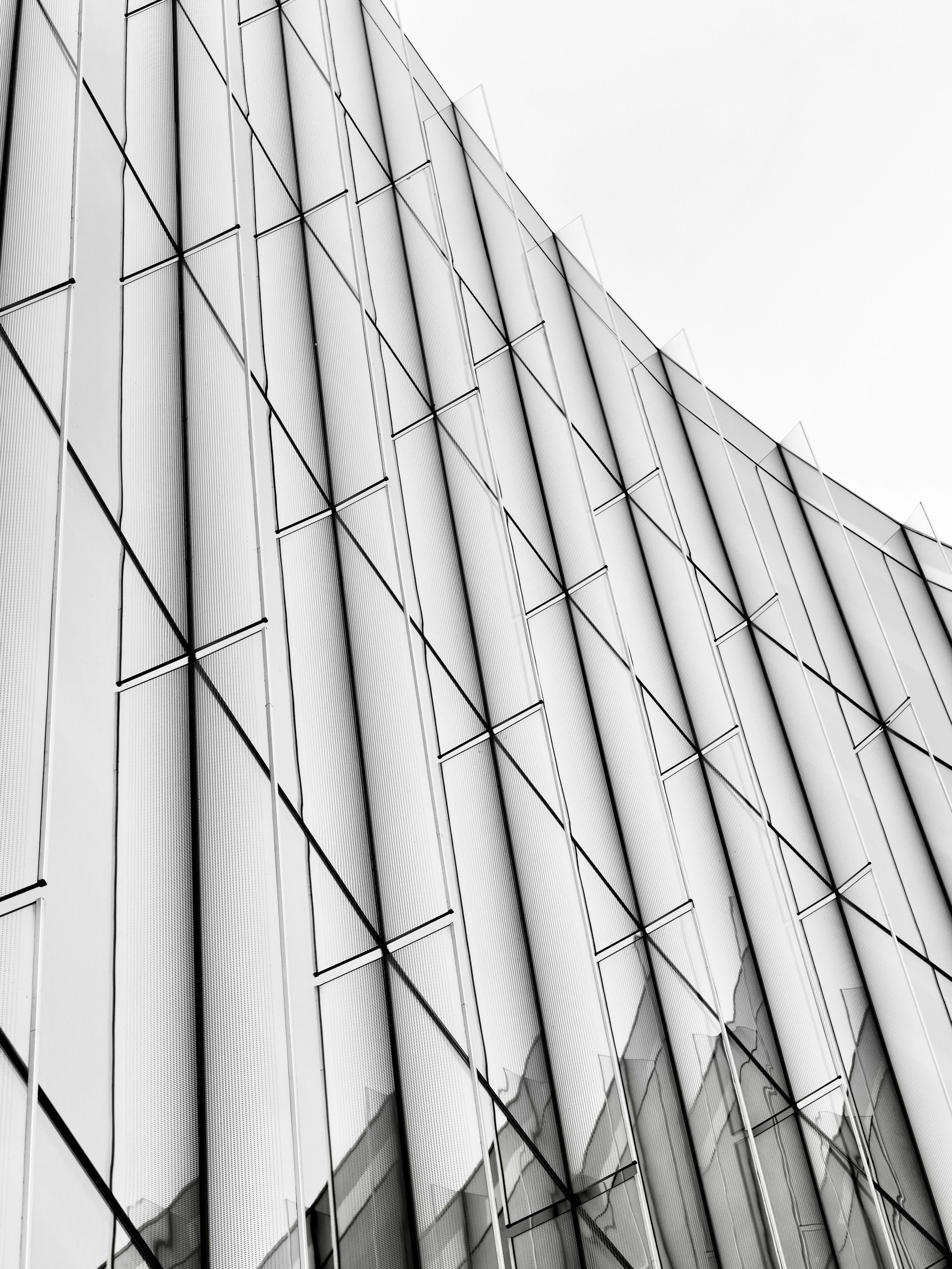 Glass panels and slender supports repeat across a modern facade.